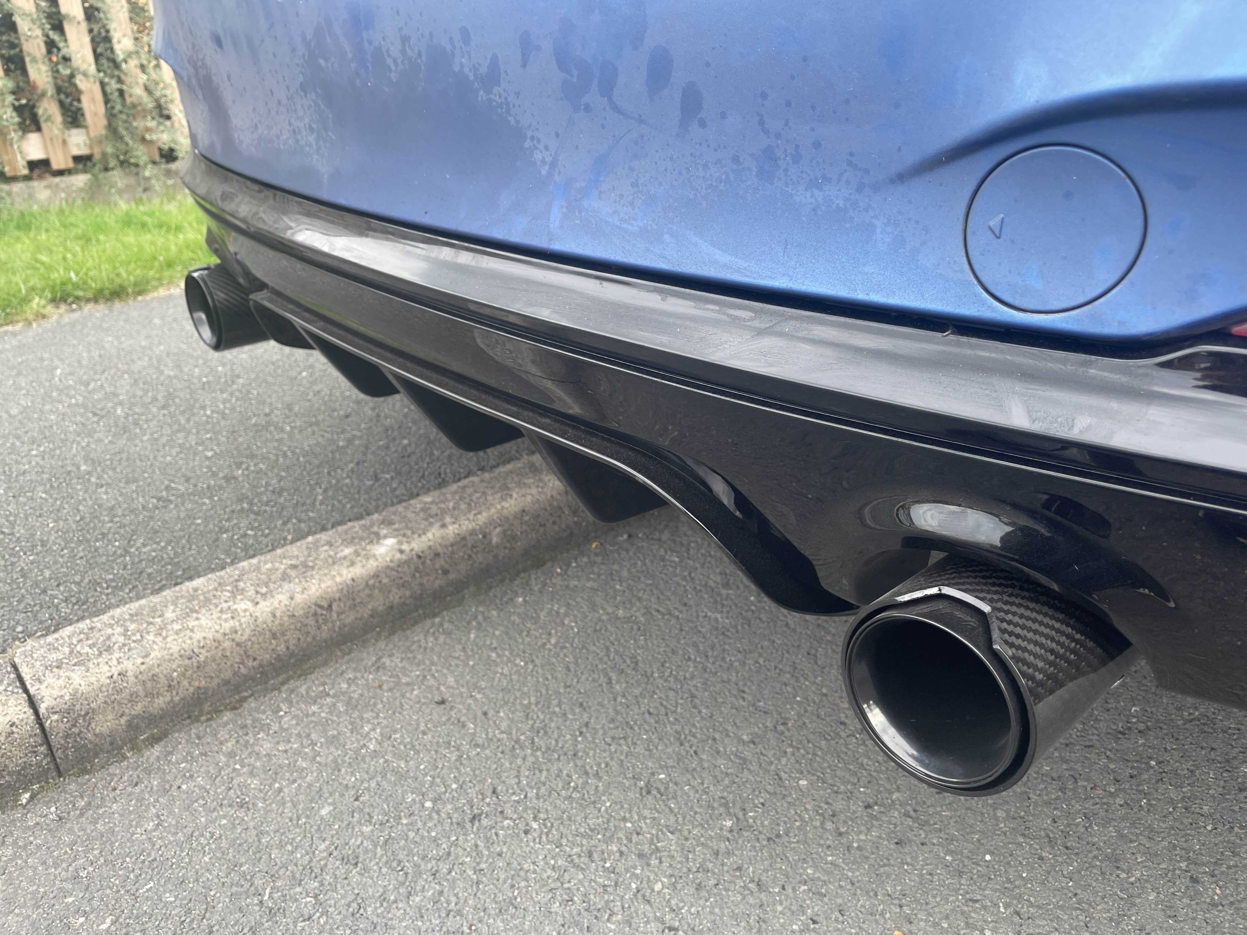 Close-up of a performance exhaust tip and rear diffuser